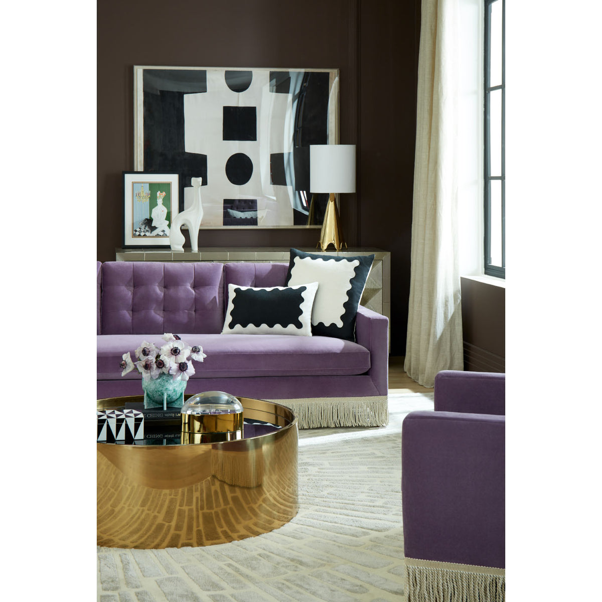 alphaville cocktail table honed brass with wright sofa