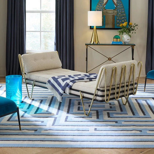 Maxime Daybed in off white boucle fabric on blue patterned rug 