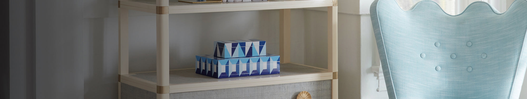 Shelf with blue decorative boxes