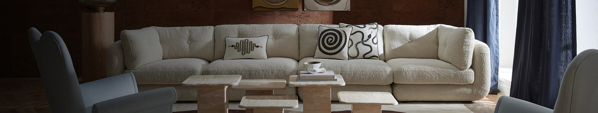 Long white sofa with graphic throw pillows