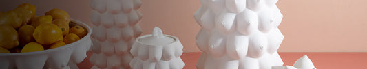 White canister with raised surface texture