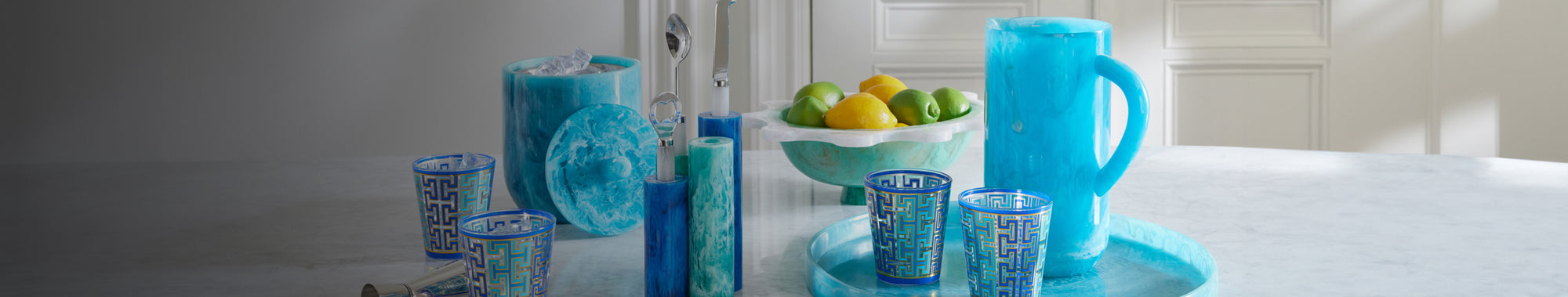 Table set with marbled blue acrylic jug and graphic glassware