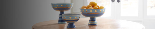 Three blue and gold pedestal bowl
