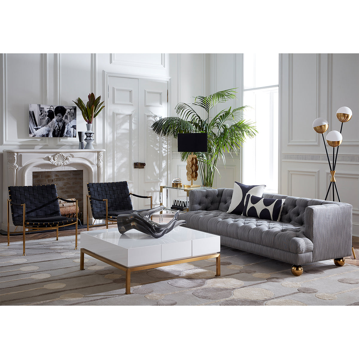 giant acrylic hand peking cocktail table baxter t-arm sofa thebes lounge chairs - styled view