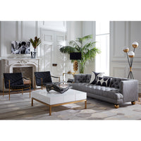 giant acrylic hand peking cocktail table baxter t-arm sofa thebes lounge chairs - styled view