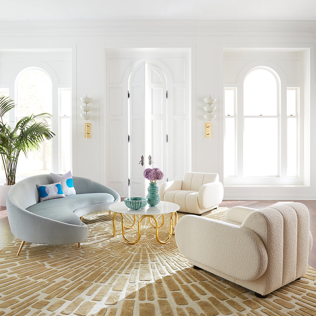 brigitte club chair ether curved sofa scalinatella cocktail table living room - styled view