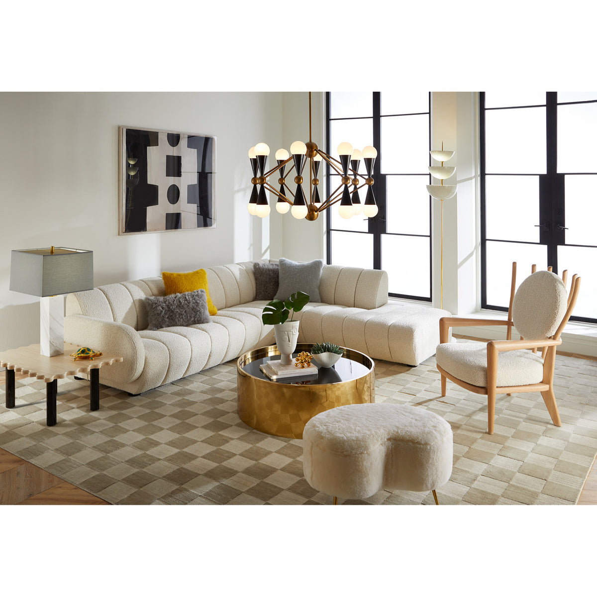 alphaville cocktail table honed brass with voltaire chair