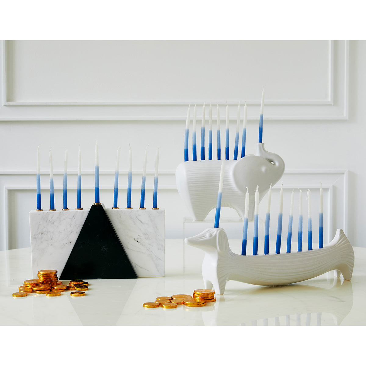 ceramic elephant and dachshund menorahs with candles - styled view 2