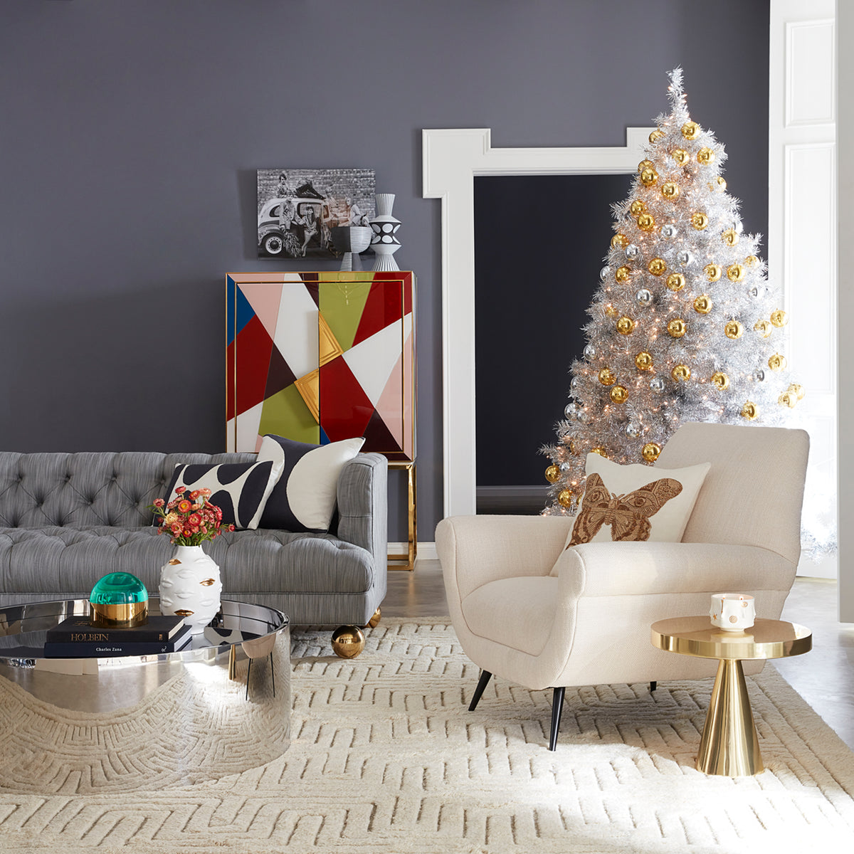 gilded gala round vase alphaville cocktail table baxter t-arm sofa marcello lounge chair christmas - styled view