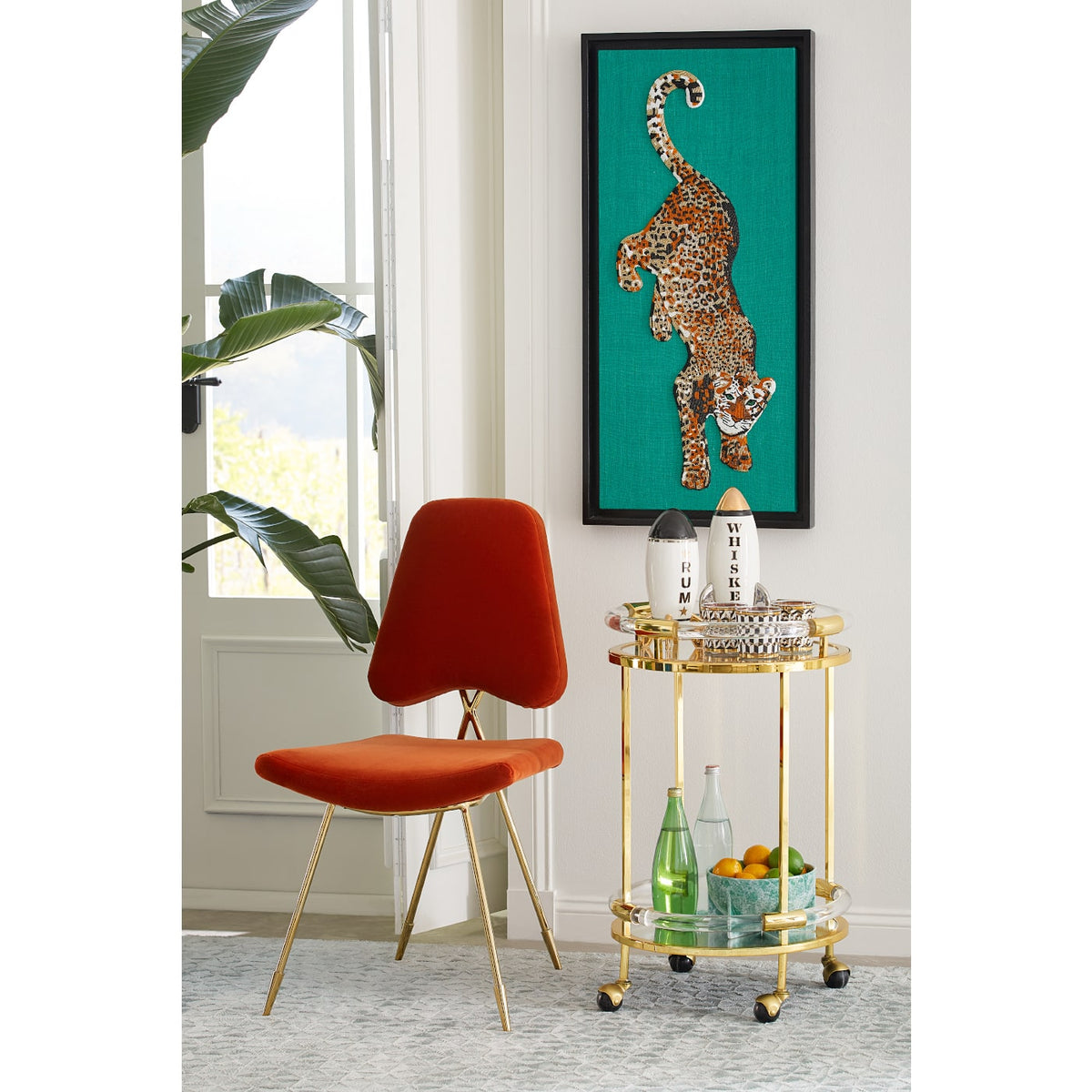 jacques round bar cart maxime dining chair leopard beaded wall art - styled view