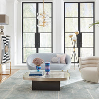 ether apartment sofa talitha starburst cocktail table ether pompidou pillows - styled view
