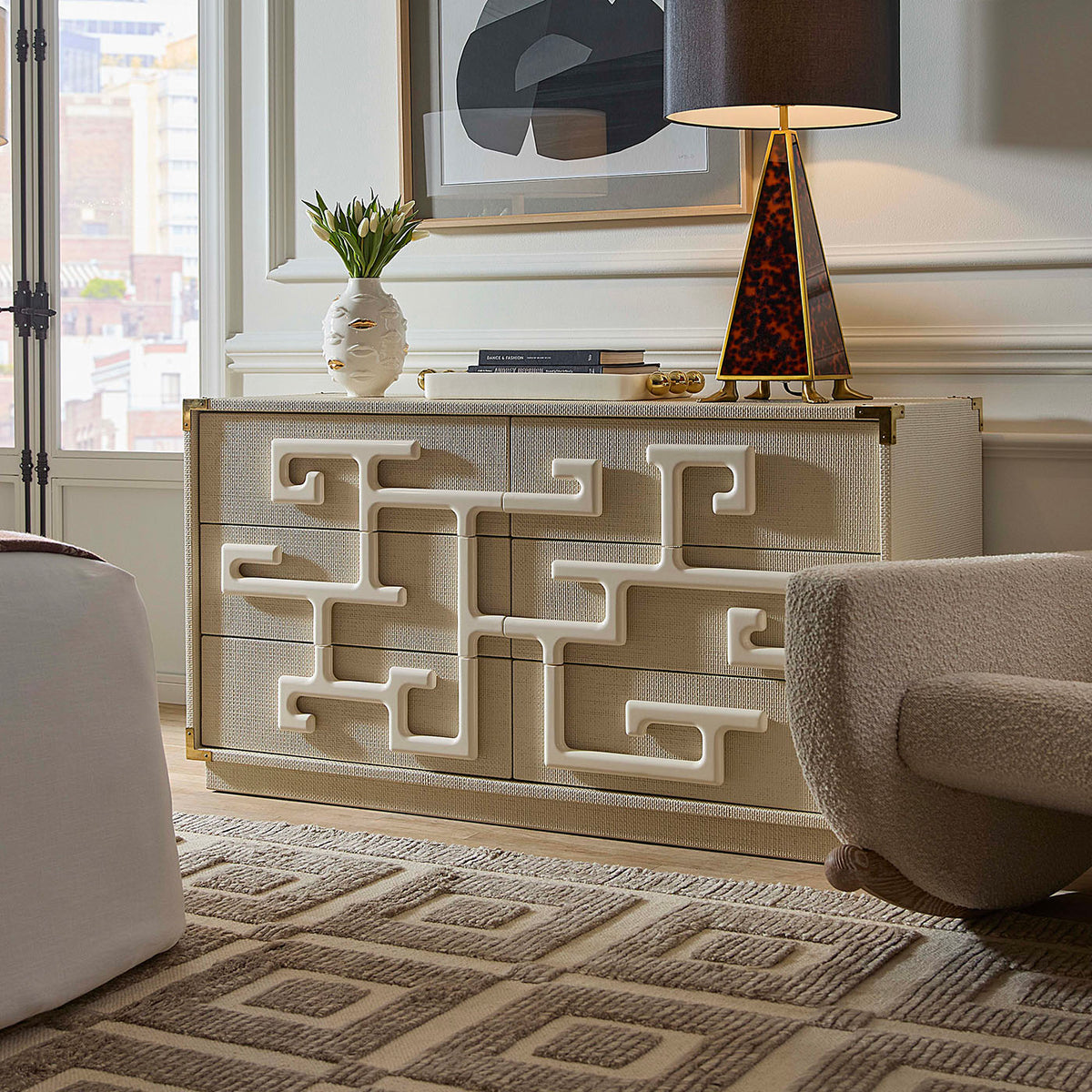 Decorative chest of drawers with geometric patterns in a stylish room.