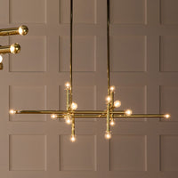 milano linear chandelier brass styled view