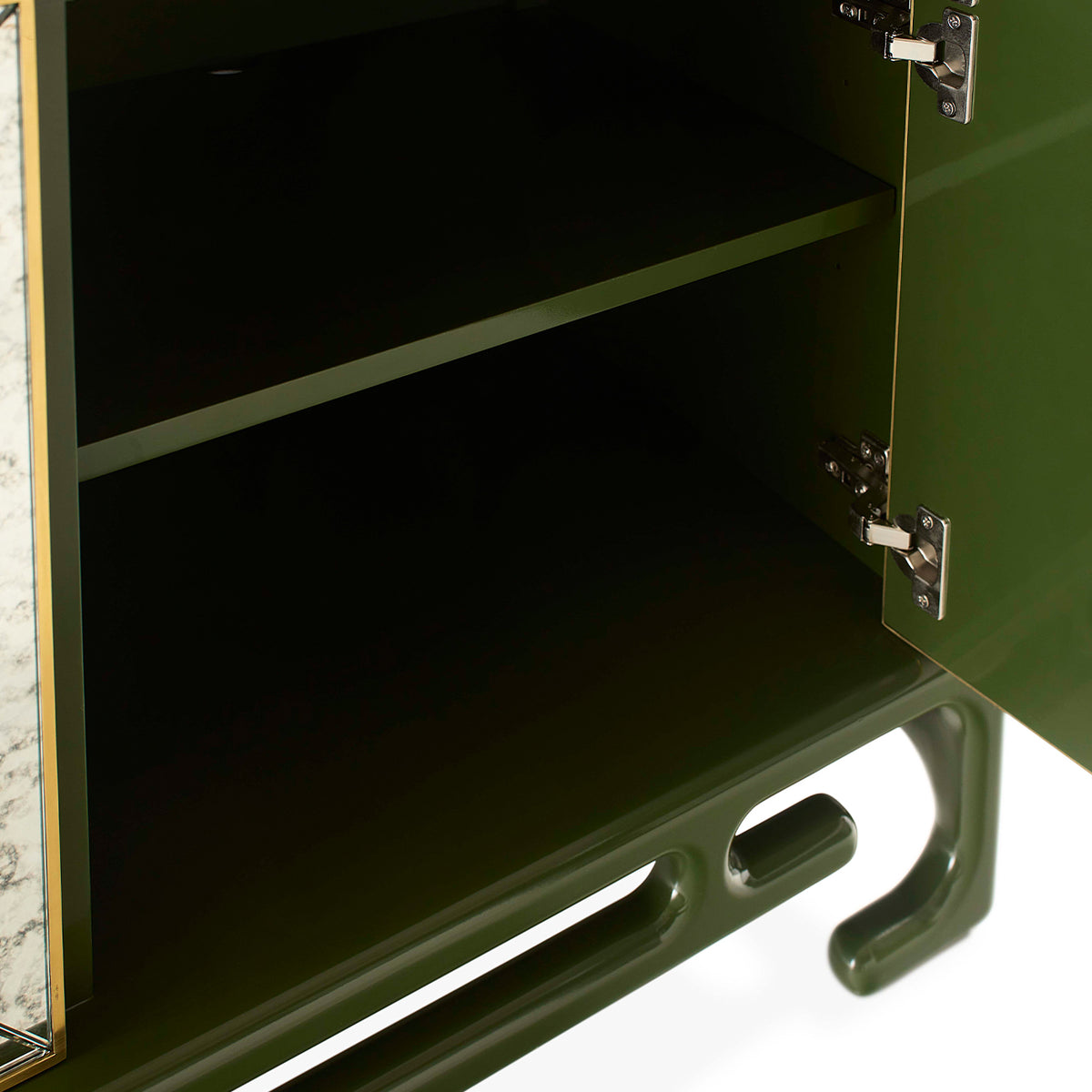 Green metal cabinet with open door on a white background