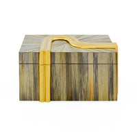 Decorative box with gold handle and striped pattern on a white background