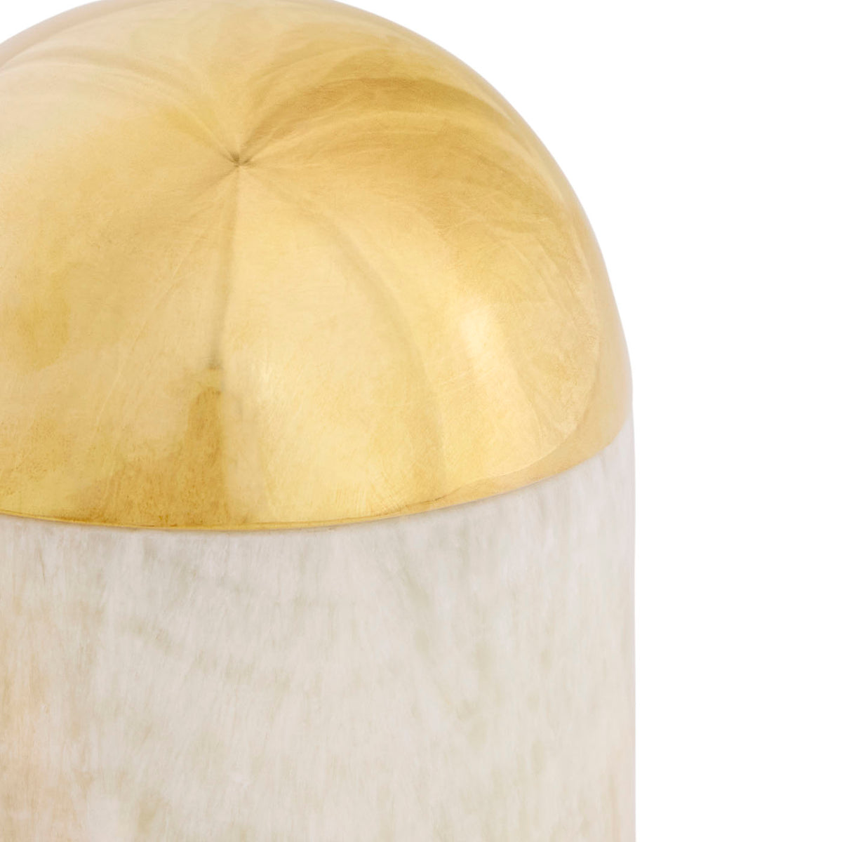 Decorative object with gold top and white base on a white background