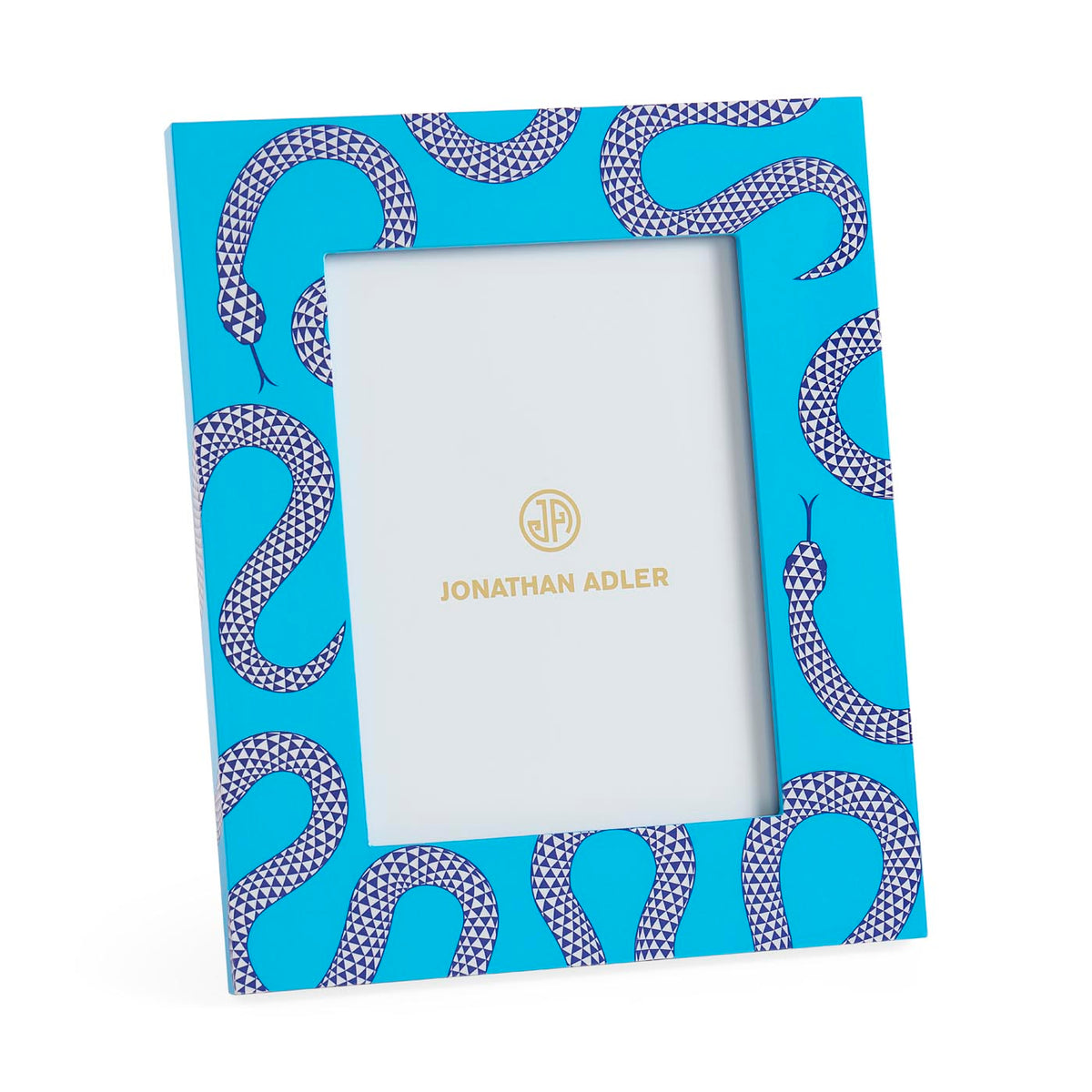 Notebook with snake pattern cover and white interior, Jonathan Adler branding visible