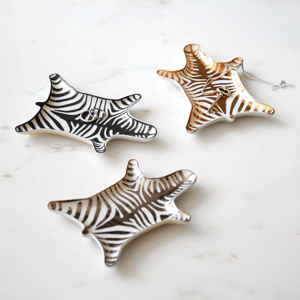 zebra stacking dish collection green background - styled view