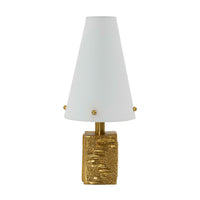 Table lamp with gold base and white shade on a white background