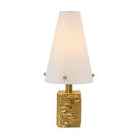 Table lamp with gold base and white shade on a white background