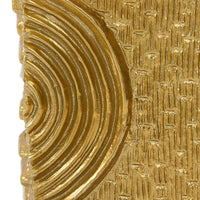Close-up of a textured gold object with concentric circular patterns