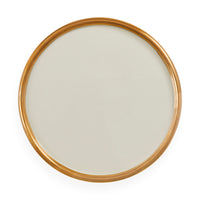 A round wall mirror with a slim, polished gold frame, shown from a top-down perspective on a clean white background.