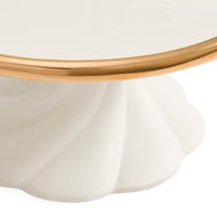 Close-up of a white pedestal table base with a fluted scalloped edge and a polished gold metal rim, shown against a white background.
