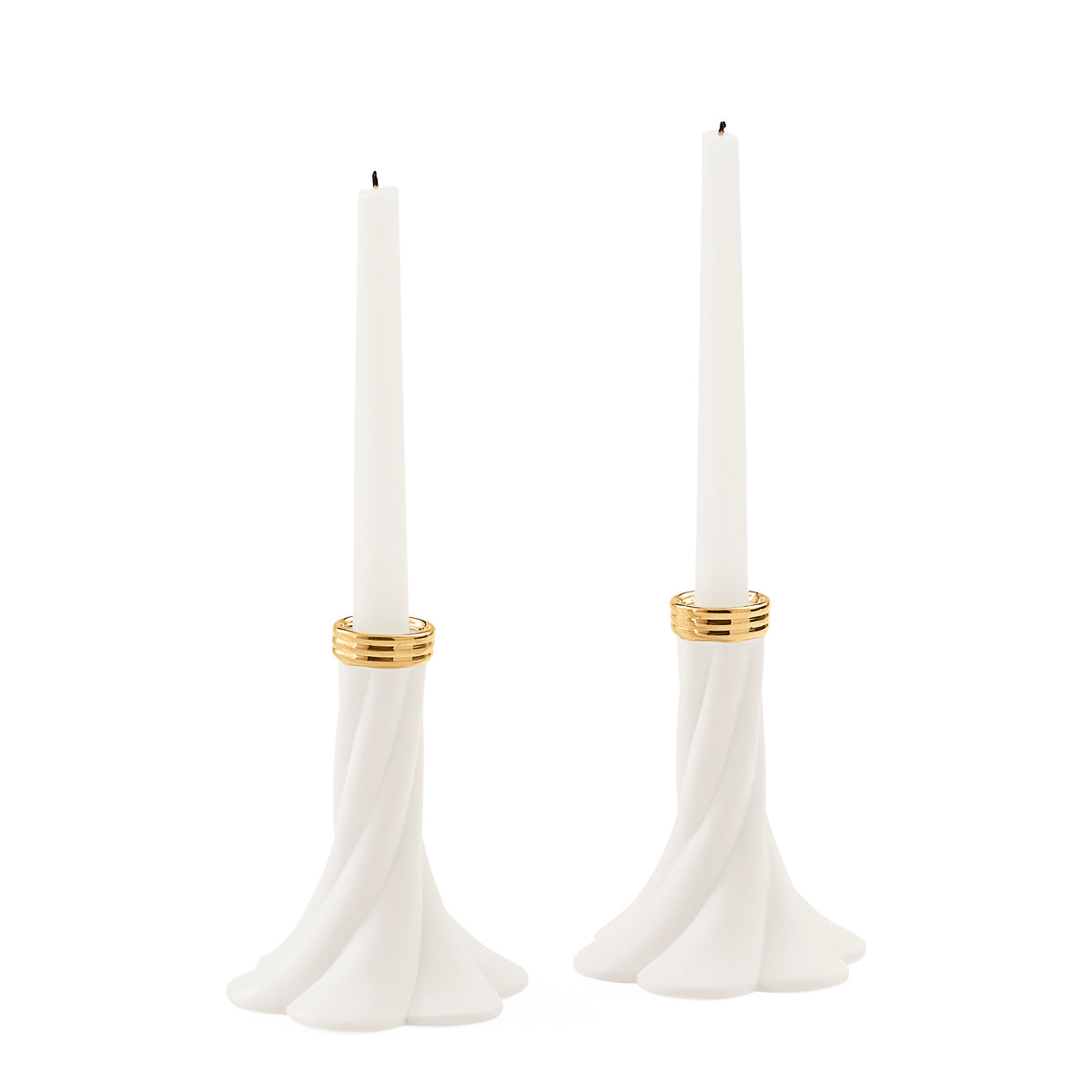 A pair of white taper candle holders with a flared, sculptural base and gold metallic bands near the top, shown on a plain white background.
