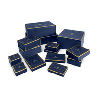 Set of blue boxes with gold accents on a white background
