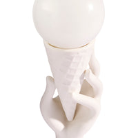 White ceramic sculpture of a hand holding a sphere on a white background