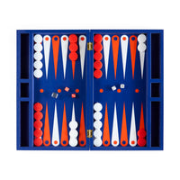 Backgammon set with red, white, and orange pieces in a blue case on a white background