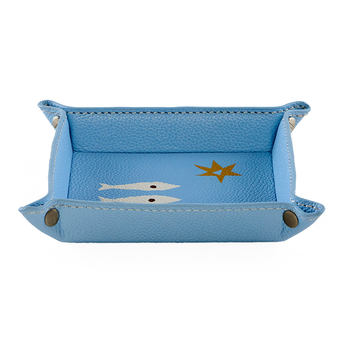 Blue leather tray with fish and star design on a white background