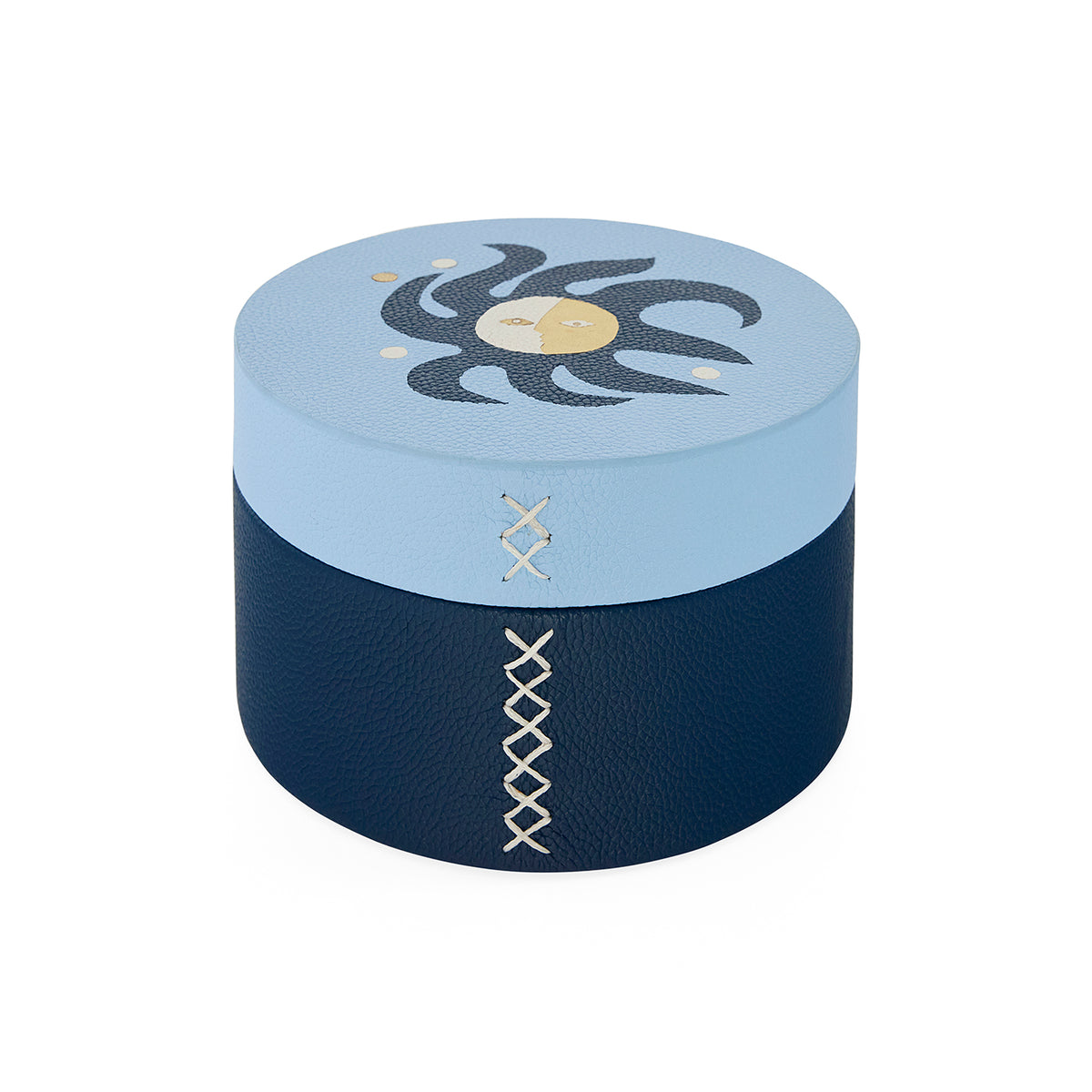 Round blue and navy box with decorative patterns on a white background