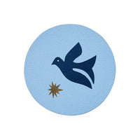Round light blue coaster with a dark blue dove and gold star design on a white background