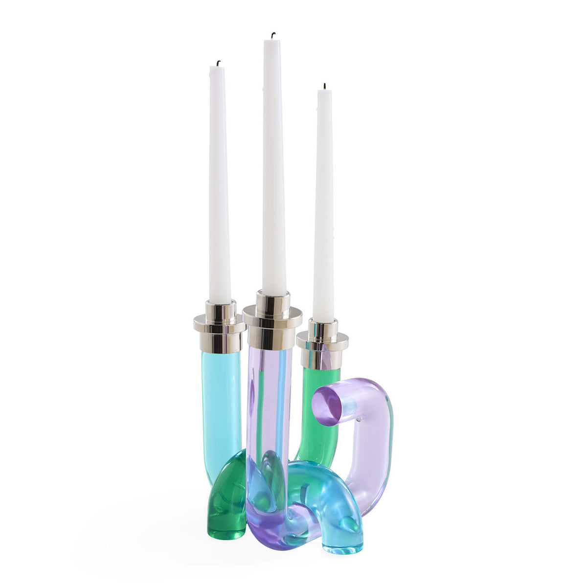 Colorful glass candle holders with white candles on a white background
