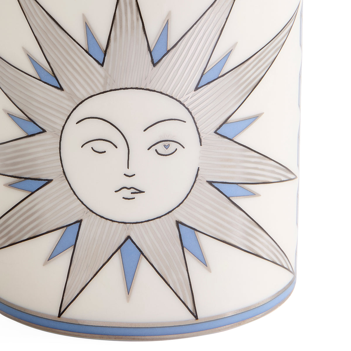 Close-up of a white ceramic vase featuring a stylized sun face with closed and open eyes, outlined in black, with light blue accents in the starburst rays.