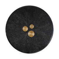 Black textured button with three gold buttons on a white background