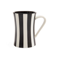 A ceramic mug with a bold black and white vertical stripe pattern, featuring a curved handle and a flared rim, shown on a plain white background.