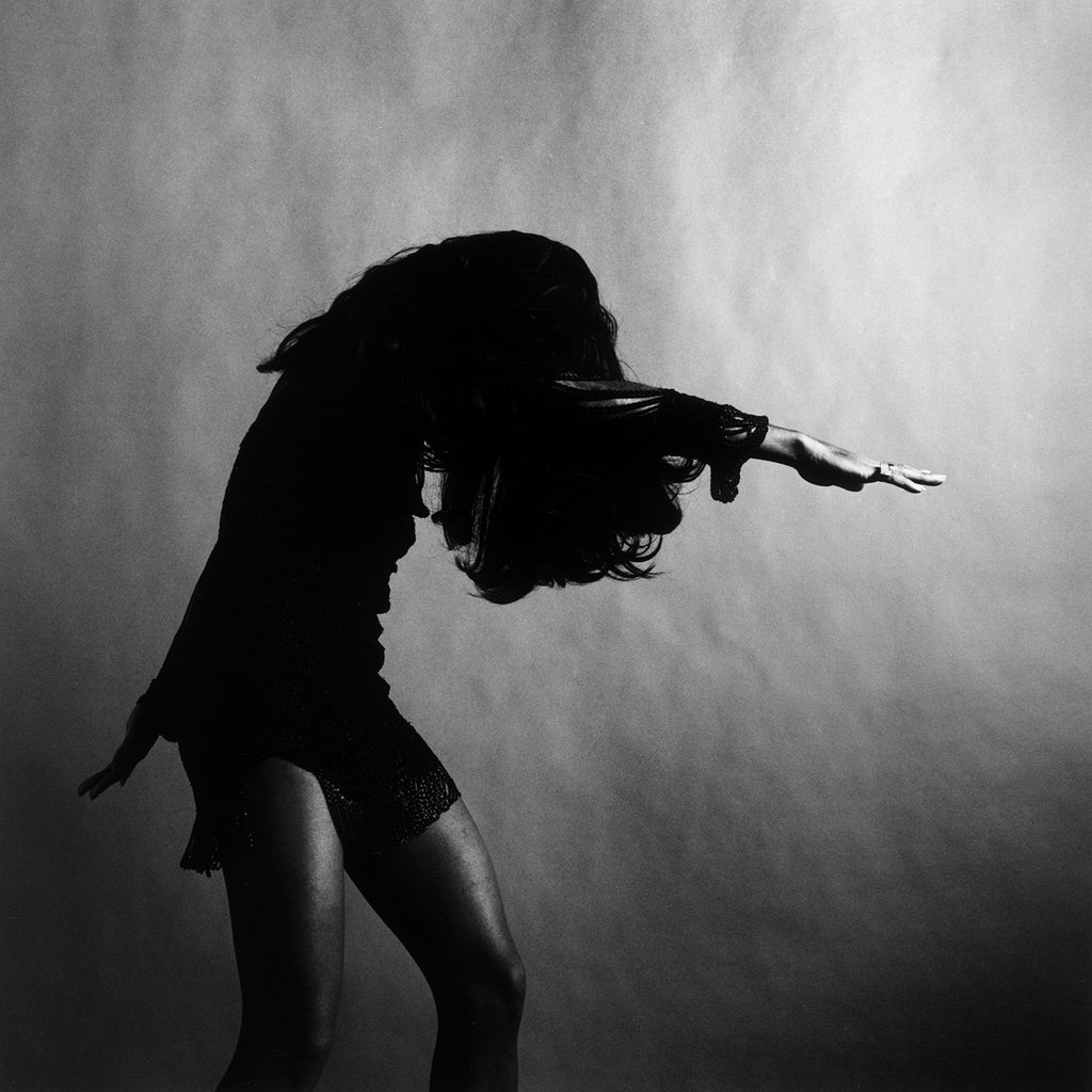 "Tina Turner Head Down Arms Out" Getty Images